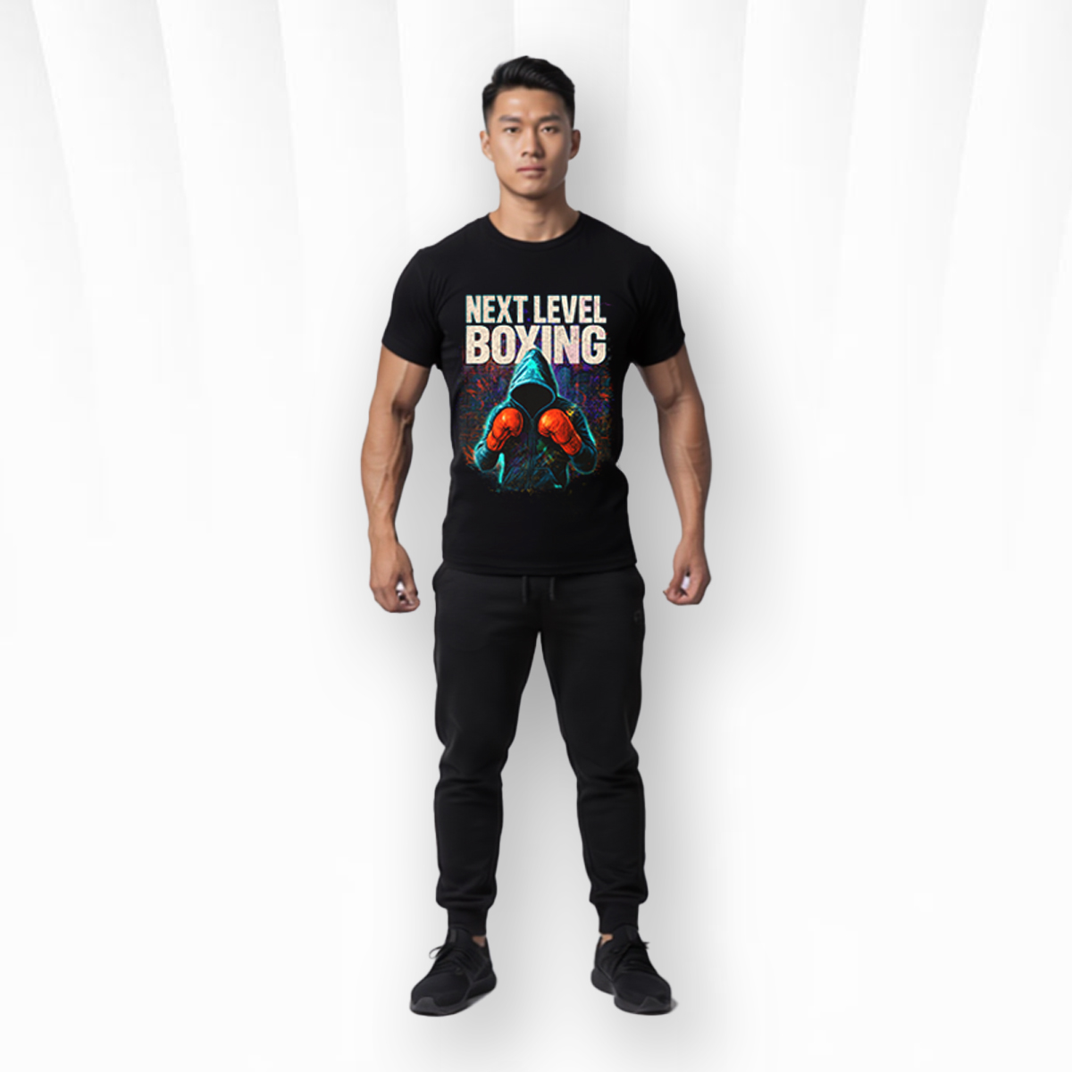 Next Level Boxing T-Shirt – Elite Gym Training Graphic Tee 1 Muscular man wearing black Next Level Boxing gym t shirt front view in boxing gym